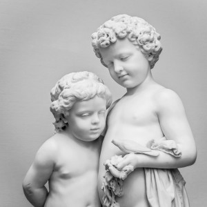 Marble sculpture of girl and boy.