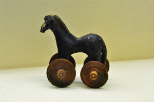 Little toy horse on wheels ancient pull toy on display at Kerameikos archaeological museum in Athens, Greece.