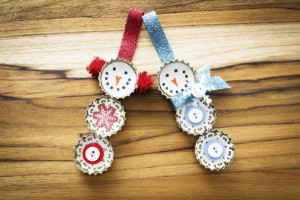 42222464 - cute hand made recycled christmas ornaments on a wooden table