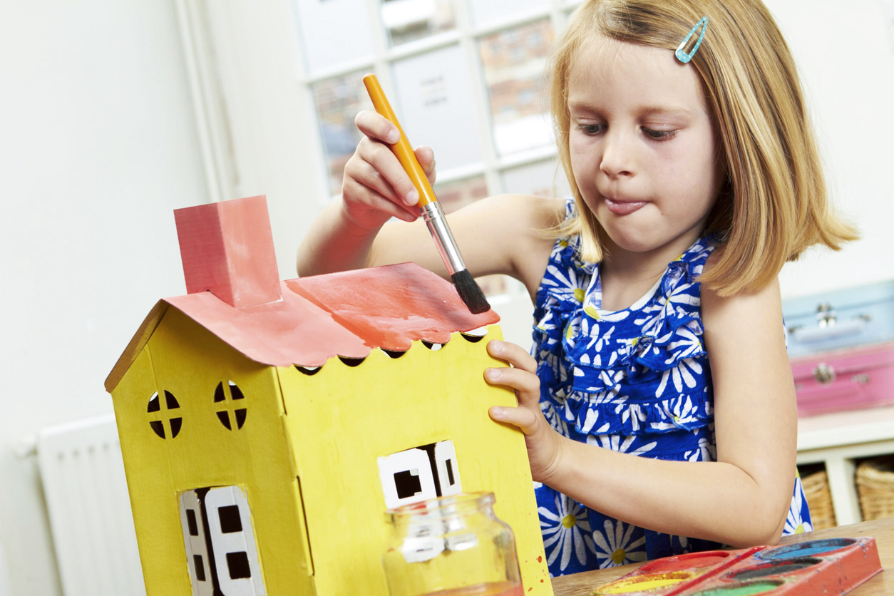 47918458 - little girl painting model house