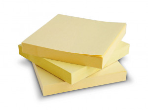 12464477 - block of yellow post it notes isolated on white